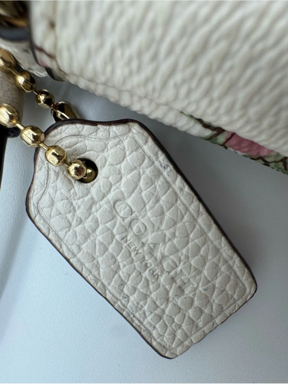 Coach Cream Floral Leather Wristlet with Pink Accents